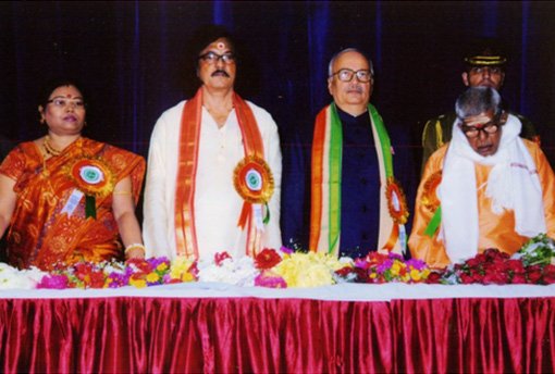 A Section of dignitaries standing of the dais.