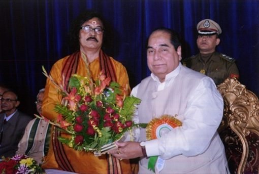 Dr. Ramkrishna Sastri, Presenting a Flower Bouquet to Dr. D. Y. Patil, Hon'ble Governor of Tripura.
